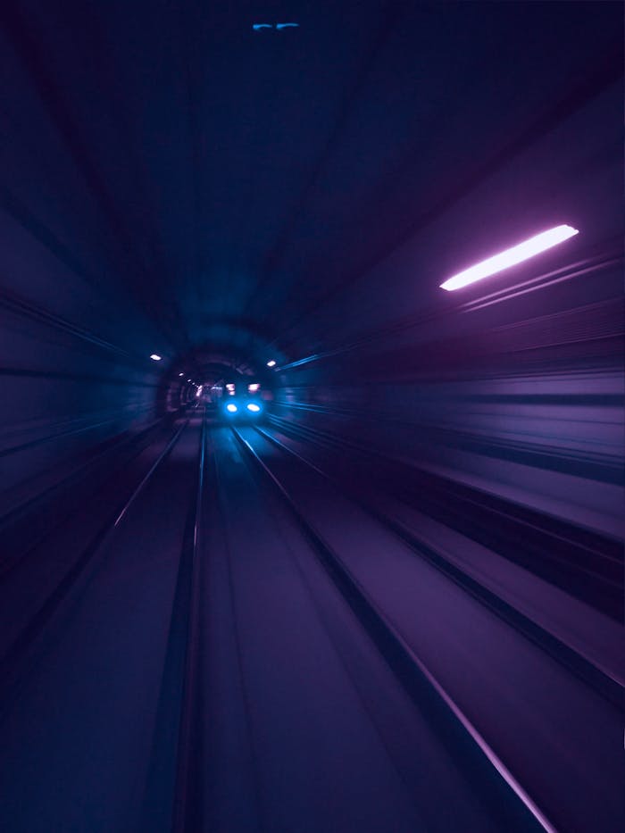 Crafting Captivating Headlines: Your awesome post title goes here Dynamic view of a subway train speeding through a tunnel with blurred motion effect.